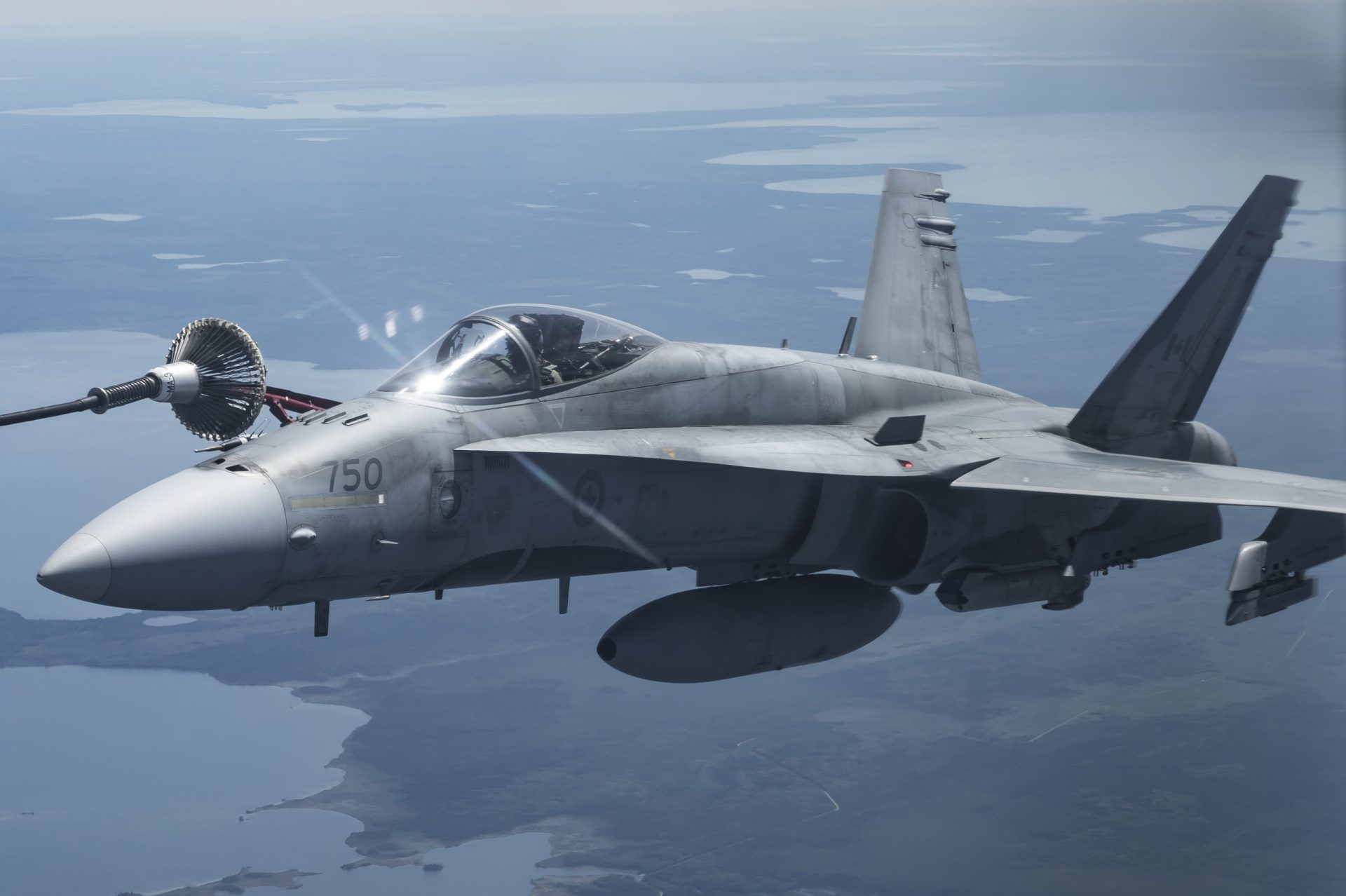 A CF-188 Hornet refuels from a CC-130 Hercules aircraft during Exercise MAPLE FLAG over Cold Lake, Alberta on June 21, 2016.

Photo: Cpl Manuela Berger, 4 Wing Imaging CK01-2016-0510-212
~
Un chasseur CF-188 Hornet est ravitaillé par un CC-130 Hercules au cours de l’exercice MAPLE FLAG, au dessus de Cold Lake, en Alberta, le 21 juin 2016.

Photo : Cpl Manuela Berger, Services d’imagerie de la 4e Escadre
CK01-2016-0510-212