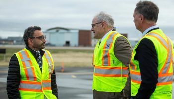 Transport Minister Omar Alghabra, left, makes an announcement with Liberal MP David McGuinty, right, and Mark Laroche, Ottawa Airport Authority president and CEO, at the Ottawa Macdonald-Cartier International Airport on Nov. 28, 2022. The Hill Times photograph by Andrew Meade