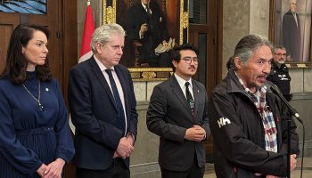 Chief Allan Adam of the Athabaska Chipewyan First Nation speaks to reporters on April 17, 2023, alongside NDP MPs Charlie Angus, Heather McPherson, and Blake Desjarlais. The Hill Times photograph by Kevin Philipupillai